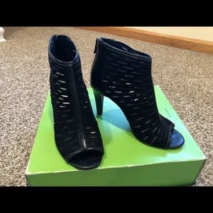 Size 7M. A.N.A open toe bootie with high heel